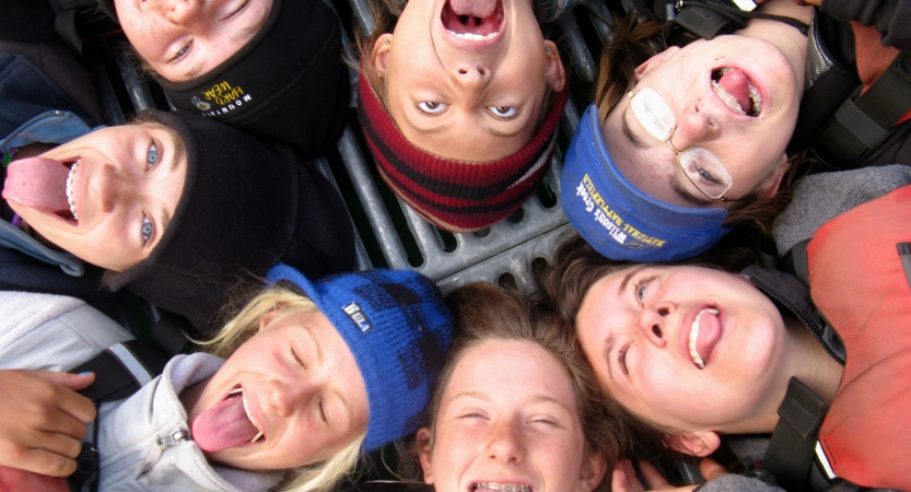 a group of outward bound students make silly faces at the camera